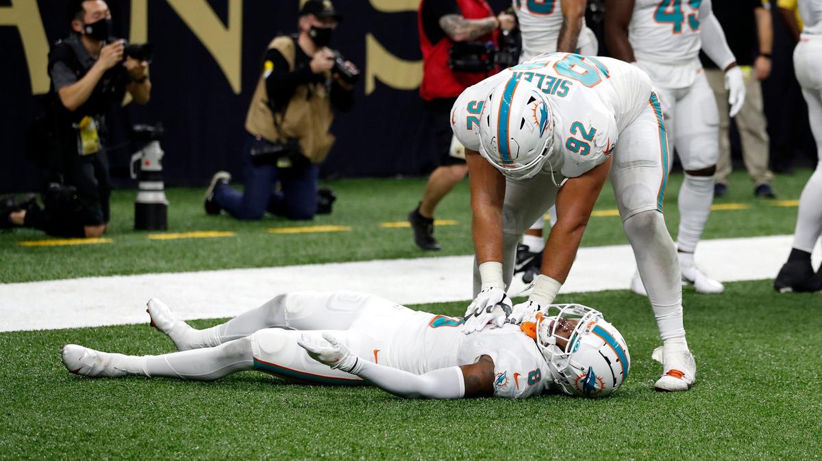 Miami Dolphins defensive end Zach Sieler (92) and free safety Jevon Holland (8) celebrate after a play during an NFL football game against the New Orleans Saints, Monday, Dec. 27, 2021, in New Orleans. (AP Photo/Tyler Kaufman)