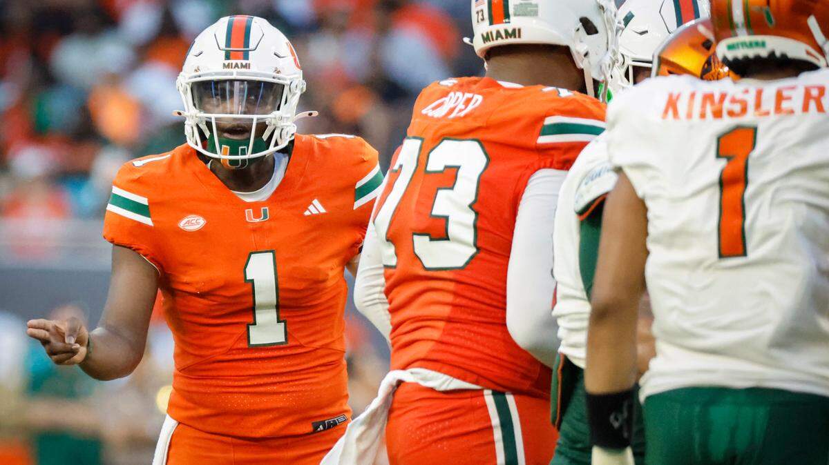 Miami Hurricanes quarterback Cam Ward (1) gestures in the huddle during the game against the Florida A&M Rattlers at Hard Rock Stadium in Miami Gardens, Florida, on Saturday, September 7, 2024.