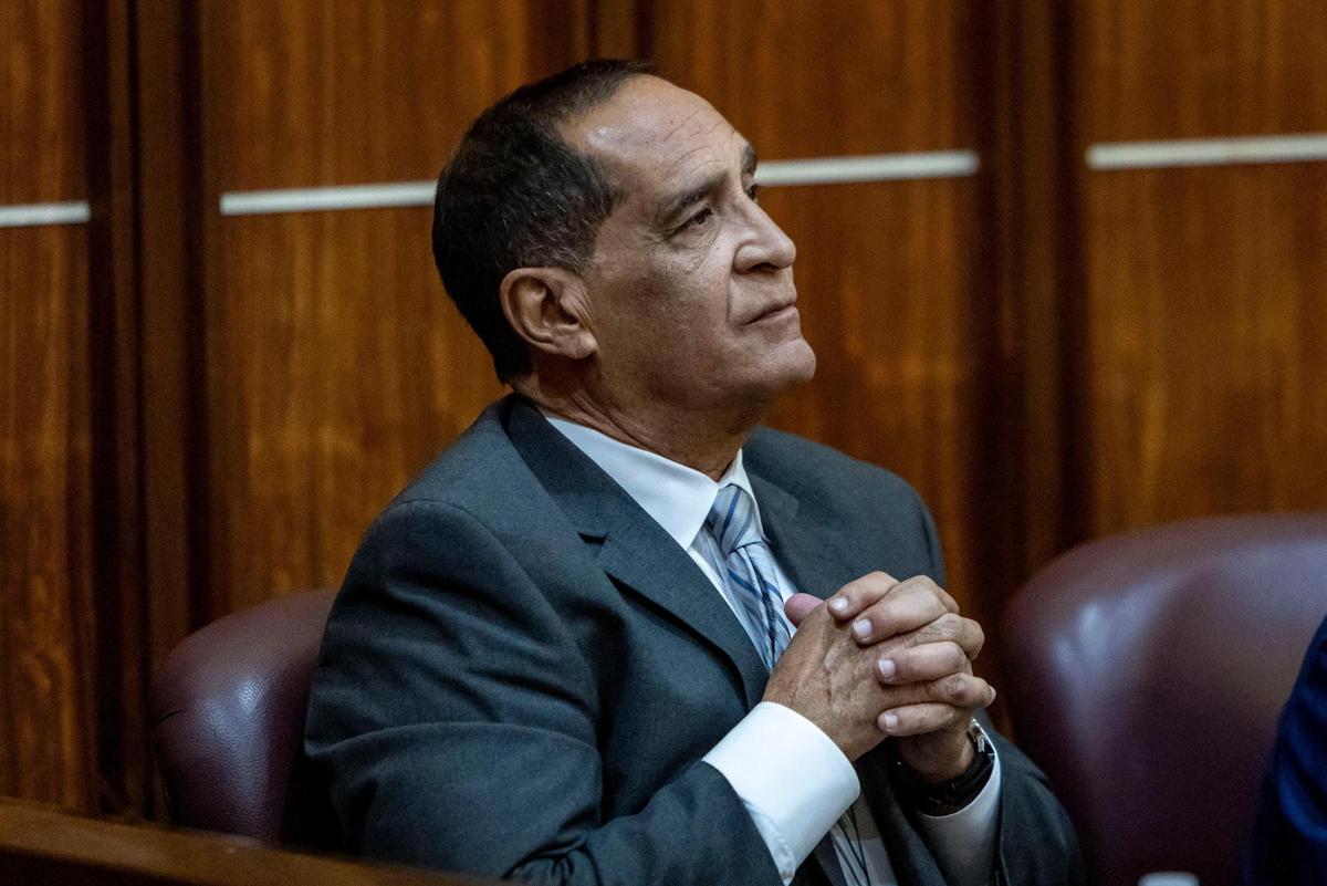 Miami, Florida, Oct. 30, 2024 - Suspended Miami-Dade Commissioner Joe Martinez, left, sits in Judge Miguel de la O’s courtroom during his trial for public corruption at the Miami-Dade County Criminal Courthouse.