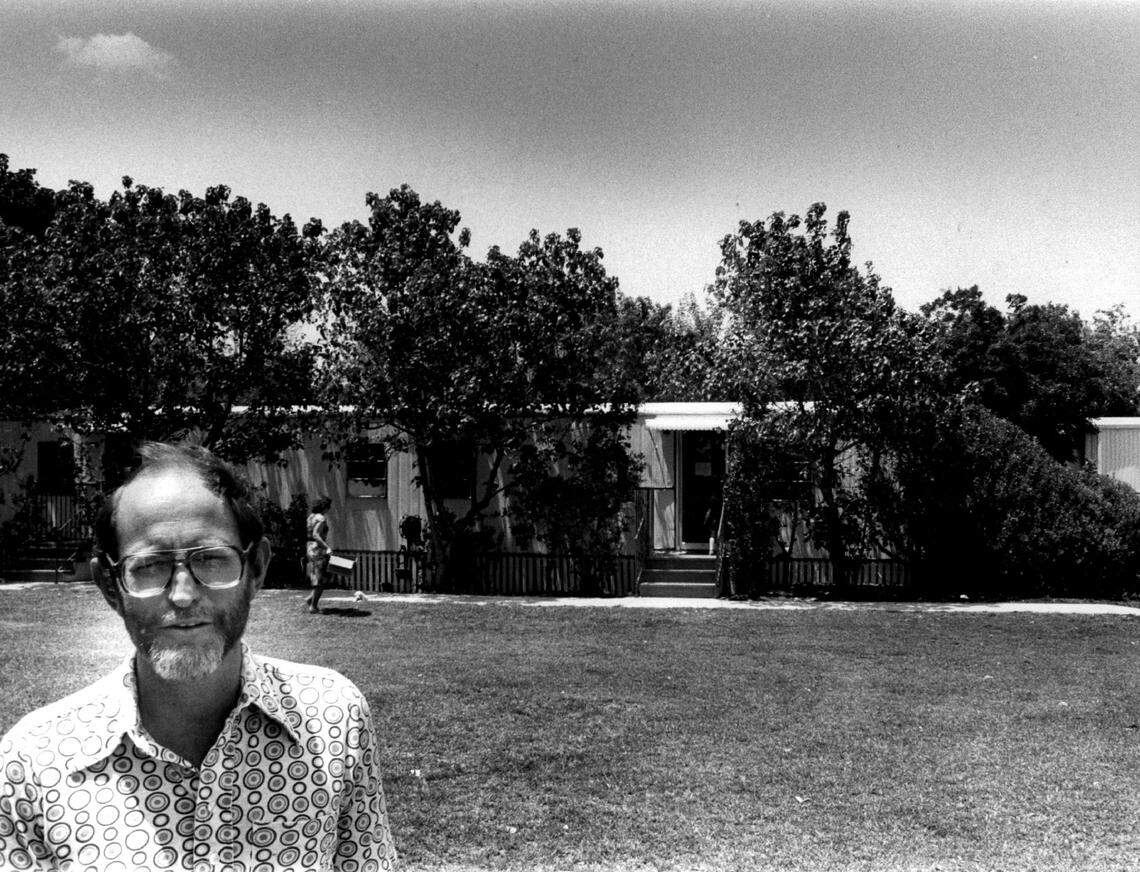 Jack Parker poses in front of his house in this 1980s photo.