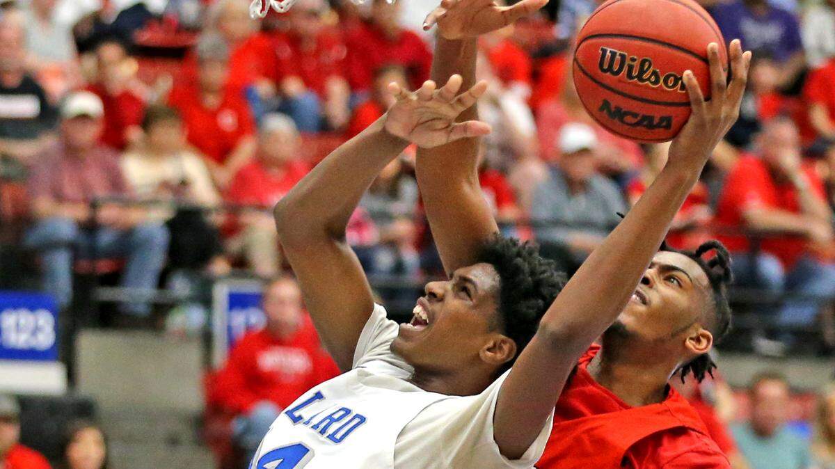Dillard HS Christopher Mattair (4) is blocked at the basket by Crestview HS Mason Cooper (30) in the 7A Boy’s Finals State Basketball Championships at the RP Funding Center in Lakeland, Florida, Saturday, March, 9, 2019.