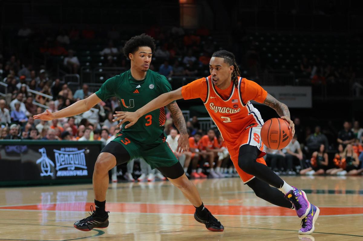 Feb 11, 2025; Coral Gables, Florida, USA; Syracuse Orange guard Lucas Taylor (3) drives to the basket past Miami Hurricanes guard Jalil Bethea (3) during the first half at Watsco Center. Mandatory Credit: Sam Navarro-Imagn Images