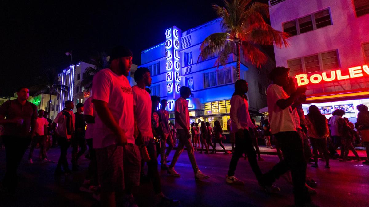 Crowds walk up and down Ocean Drive during spring break in Miami Beach, Florida, on Saturday, March 18, 2023.