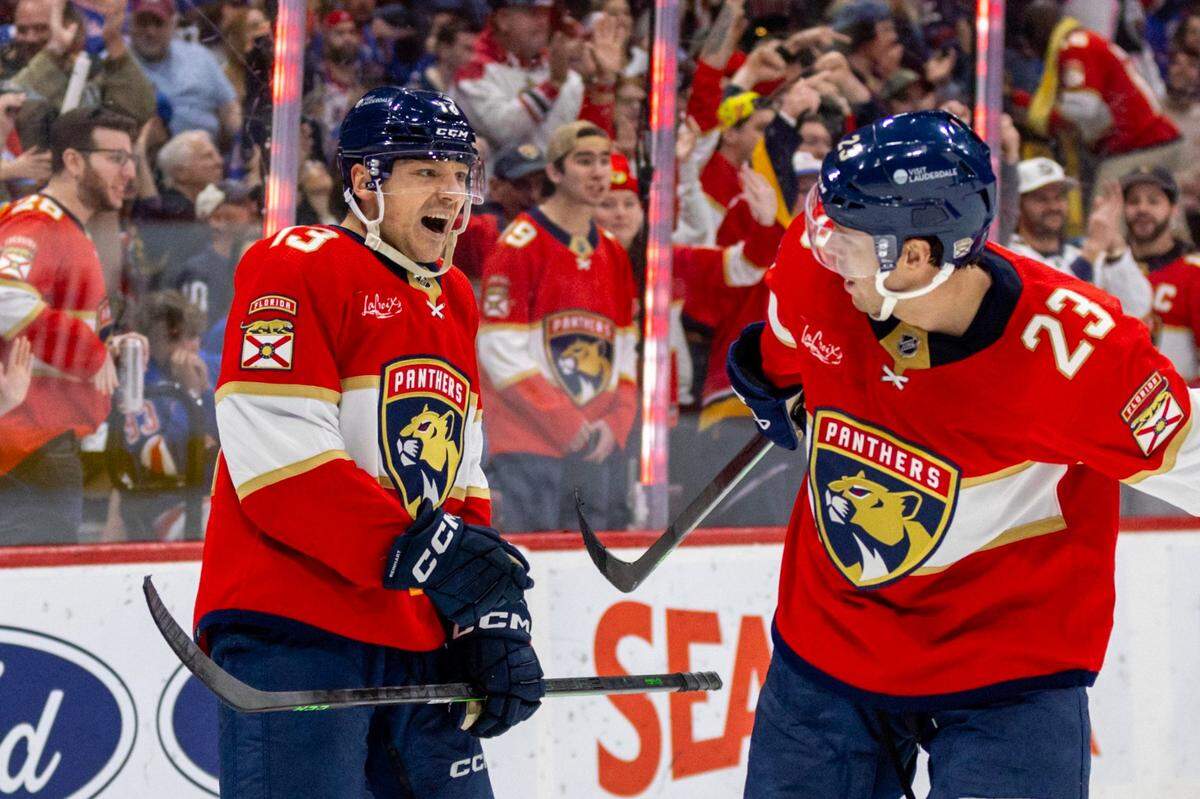Florida Panthers center Sam Reinhart (13) reacts with teammates after scoring on New York Rangers goalie Jonathan Quick (32) during the first period of an NHL game at Amerant Bank Arena in Sunrise, Florida, on Friday, December 29, 2023.