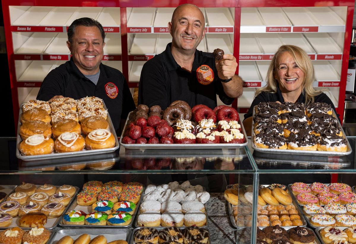Jimmy Piedrahita and Hollywood Donut Factory owners Kat Palushaj and her brother Bobby Palushaj at the brand’s new location on Bird Road in Miami.