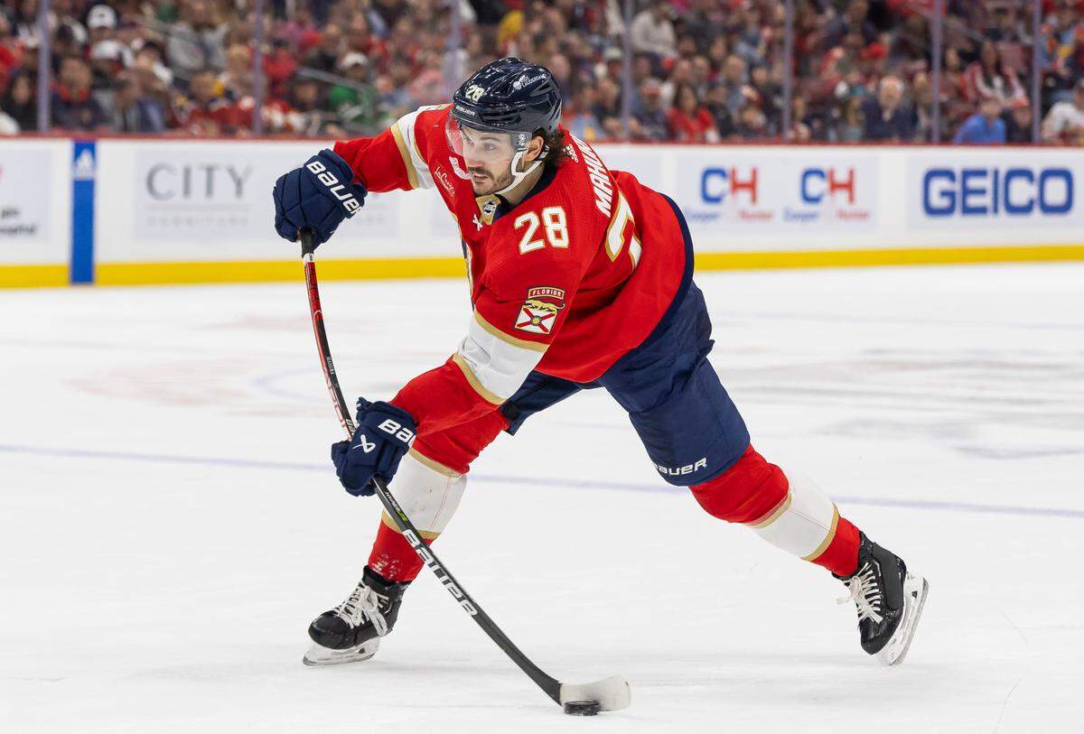 Florida Panthers defenseman Josh Mahura (28) shoots the puck against the San Jose Sharks in the second period of their NHL game at the Amerant Bank Arena on Tuesday, Oct. 24, 2023, in Sunrise, Fla.