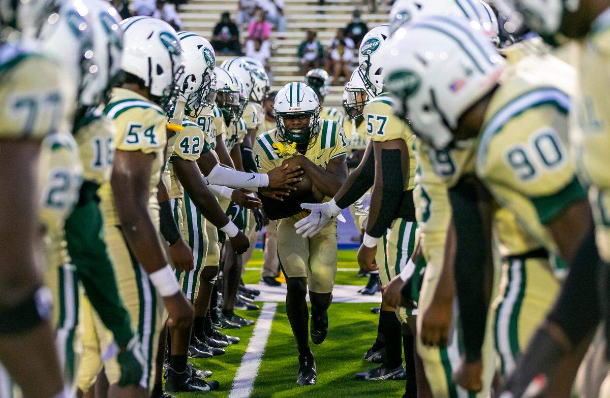 Miami Central Rockets warm up before the start of their football game against the Northwestern Bulls on Friday, October 1, 2021 at Nathaniel Traz Powell Stadium in Miami, Florida.