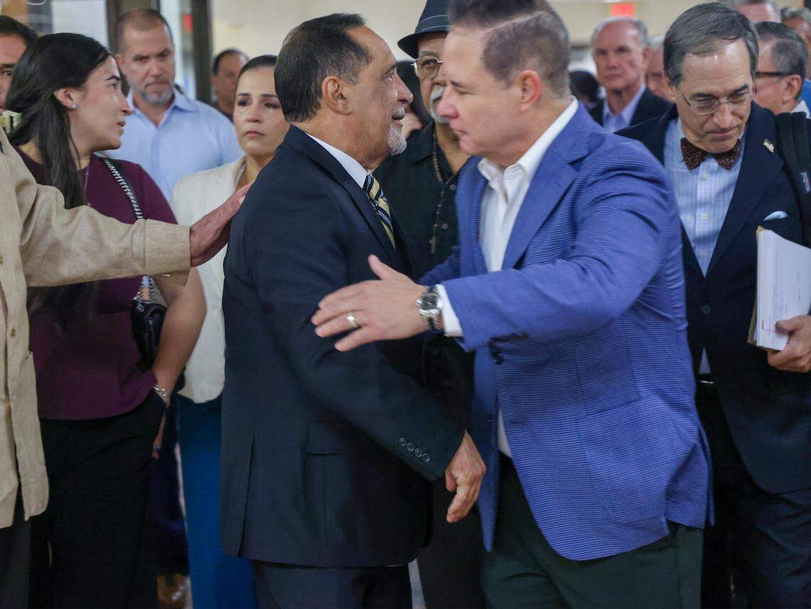 Surrounded by family, friends, and supporters, former Miami-Dade Commissioner Joe Martinez, center-left, thanks them after Judge Miguel de la O sentenced Martinez to a three-year prison sentence after being found guilty of public corruption on Monday, September 15, 2025, inside Courtroom 2-4 at the Richard E. Gerstein Justice Building in Miami, Florida. Martinez posted bail and will remain free while the appeals court rules that de la O may issue a sentence lower than what's in the sentencing guidelines.