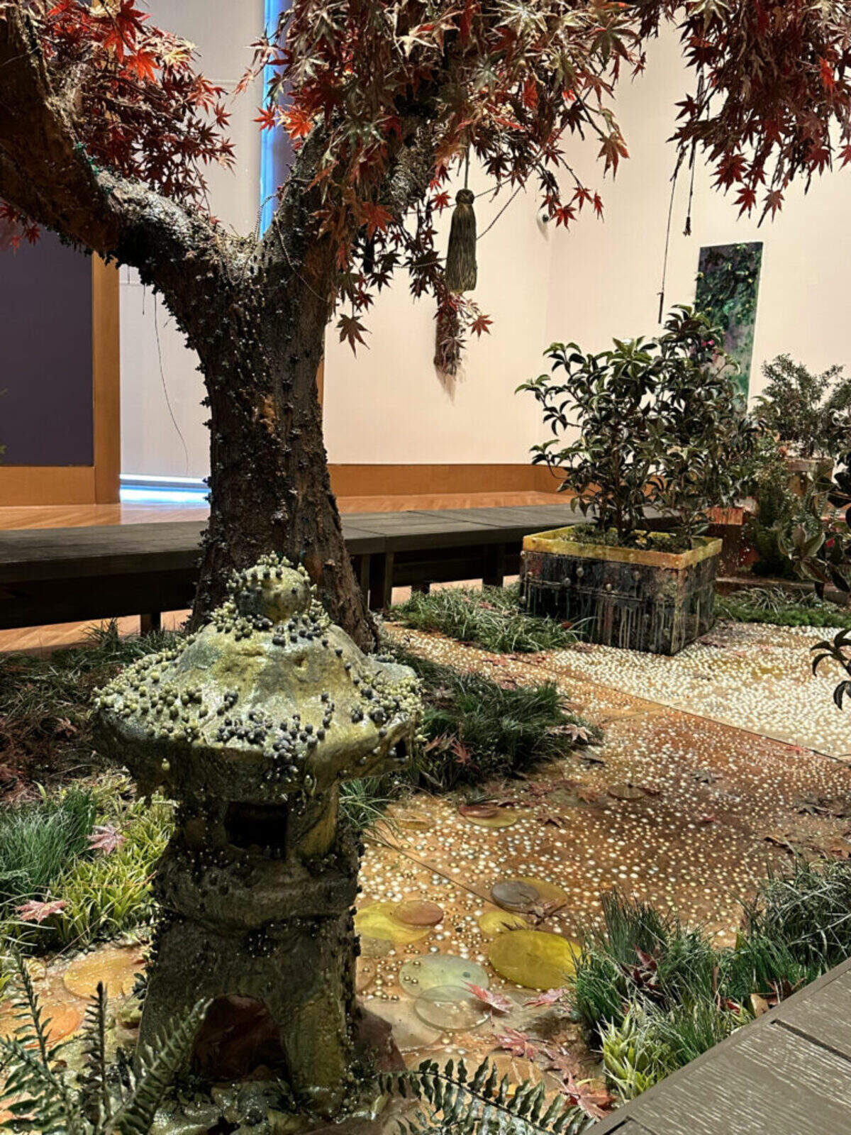 “Endless Autumn” is a sculpture of a jeweled Japanese garden created out of plastic by Cristina Lei Rodriguez.