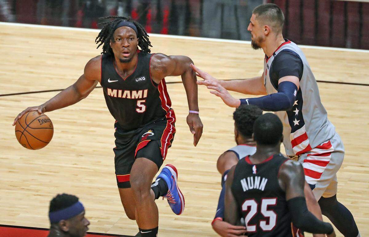 Miami Heat center Precious Achiuwa (5) drives the ball against the Washington Wizards at AmericanAirlines Arena in Miami on Friday, February 5, 2021.