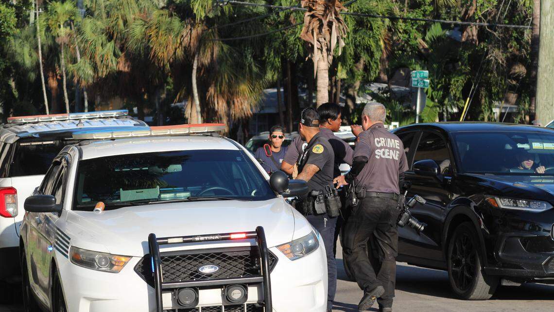 Miami police officers gather outside the Miami Riverfront Residences at 2601 NW 16th Street Road Wednesday, May 7, 2025. Police helped Suffolk County Police detectives conduct a search warrant at a unit there in connection with a Long Island homicide.