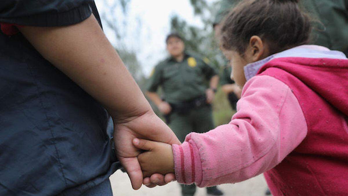 U.S. Border Patrol agents take into custody Central American immigrants near McAllen, Texas, crossing the border illegally to request asylum, in 2017.