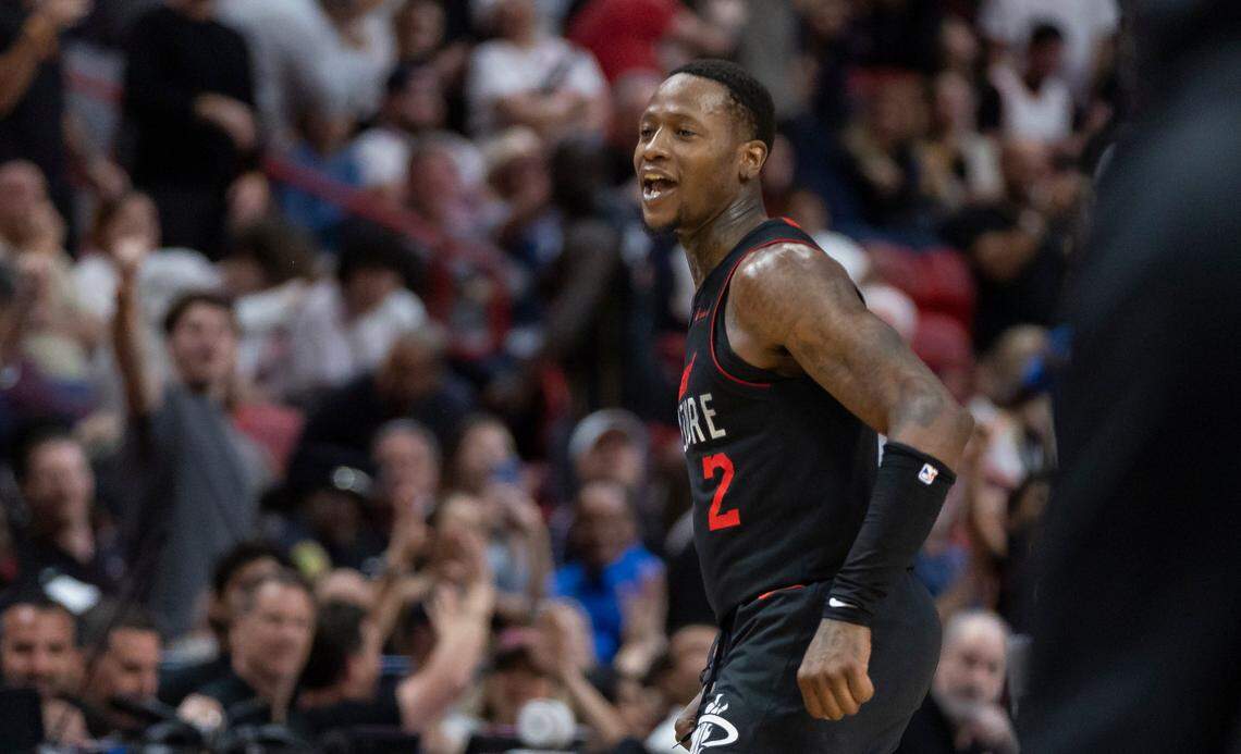 Miami Heat guard Terry Rozier (2) reacts after scoring a three-point shot against the New York Knicks in the second half of their NBA game at Kaseya Center on April 2, 2024, in Miami.