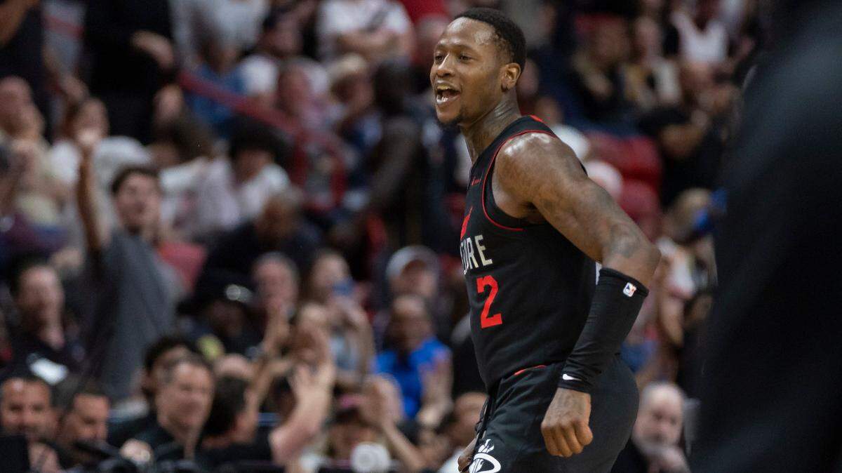 Miami Heat guard Terry Rozier (2) reacts after scoring a three-point shot against the New York Knicks in the second half of their NBA game at Kaseya Center on April 2, 2024, in Miami.