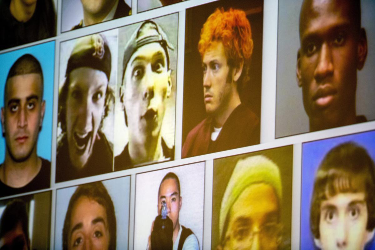 Images of known school shooters are projected onto the screen during a symposium hosted by Miami police for the faculty and staff of The Cushman School.