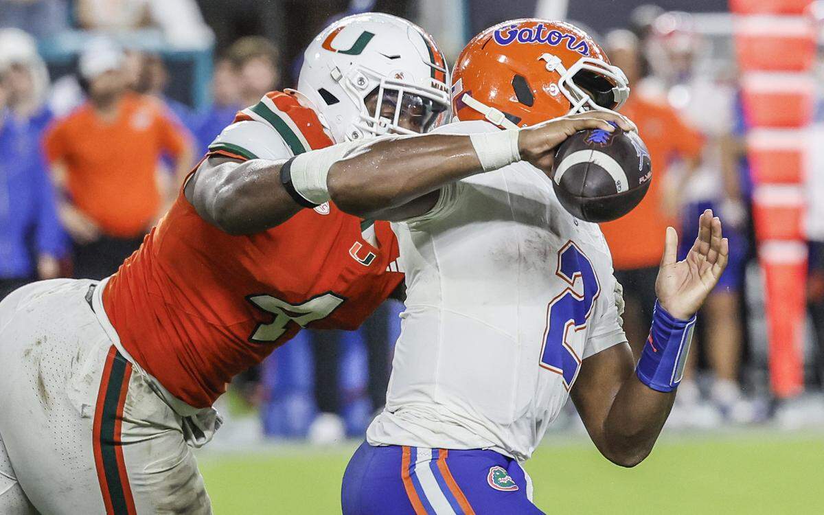 Miami Hurricanes defensive lineman Rueben Bain Jr. (4) pressures Florida Gators quarterback DJ Lagway (2) during their NCAA football game at Hard Rock Stadium in Miami Gardens, Florida, on Saturday, September 20, 2025.