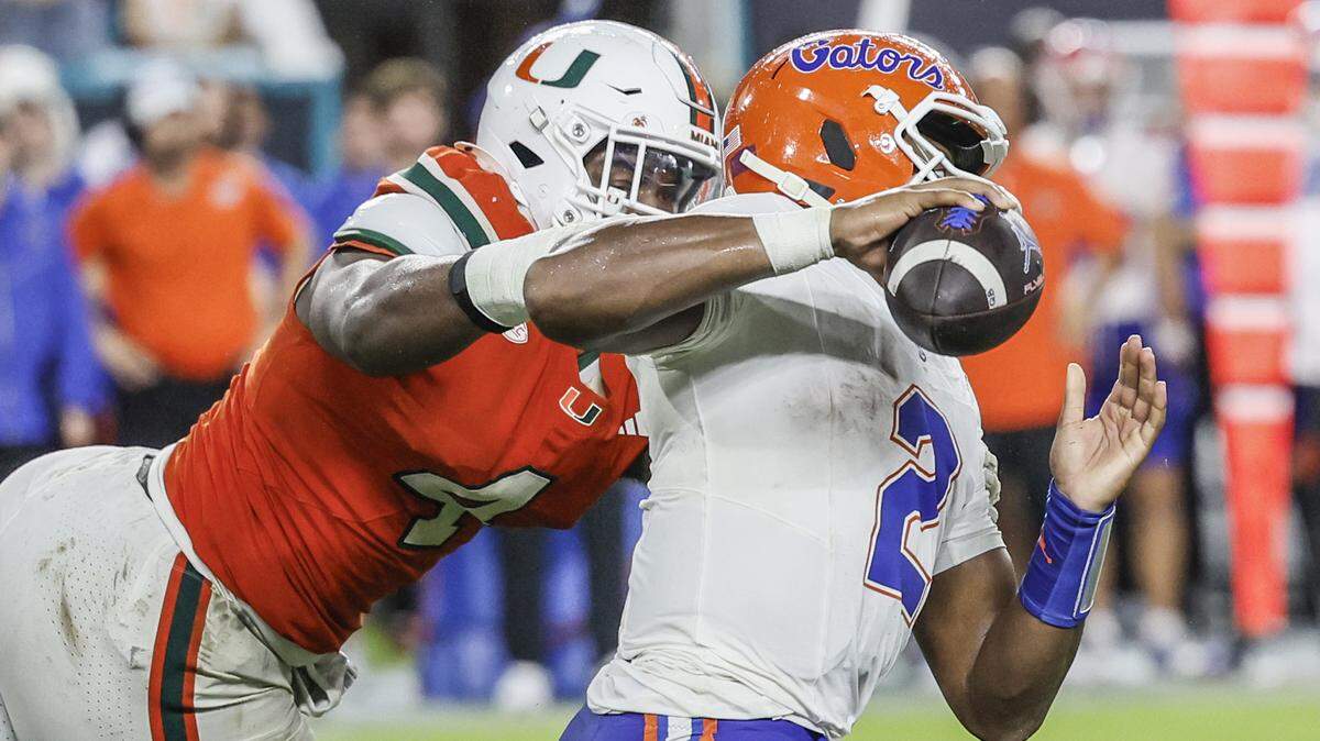 Miami Hurricanes defensive lineman Rueben Bain Jr. (4) pressures Florida Gators quarterback DJ Lagway (2) during their NCAA football game at Hard Rock Stadium in Miami Gardens, Florida, on Saturday, September 20, 2025.