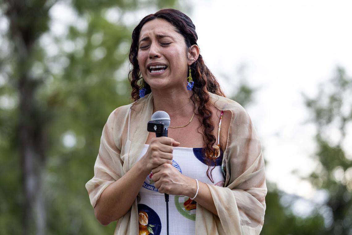 Laura Munoz from Florida Student Power cries as she prays during a vigil outside Alligator Alcatraz on Sunday, August 17, 2025, in Ochopee, Fla.
