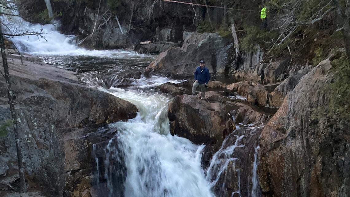 The woman’s body was pulled up the waterfall using ropes, officials said.
