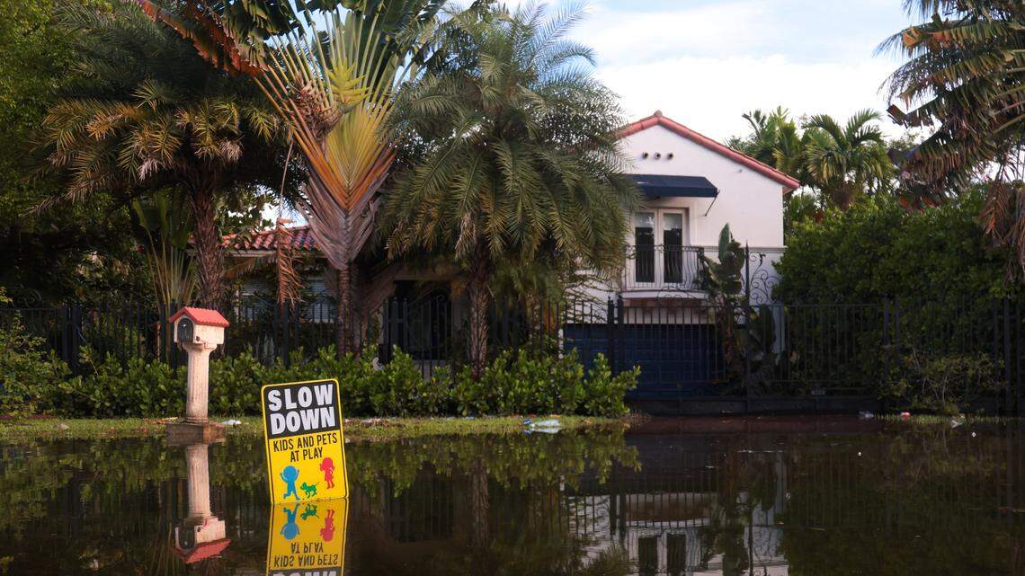 Flooded waters cover the driveway to a home along NE 78th Street due to King tides in Miami, Oct. 6, 2025.