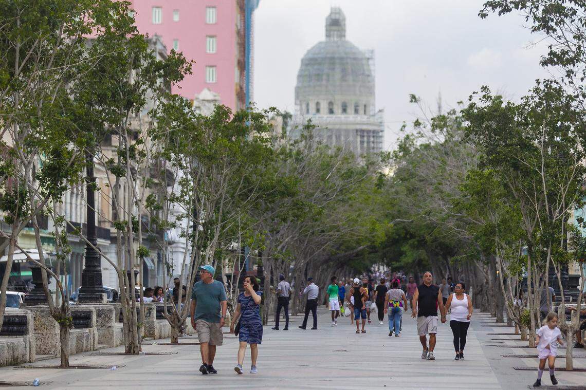 Paseo del Prado is another gathering place in Havana. In the distance, the Capitolio can be seen.
