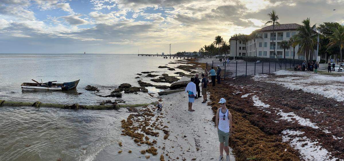 Passersby greeted several Cuban migrants at a Key West beach on May 31, 2022.