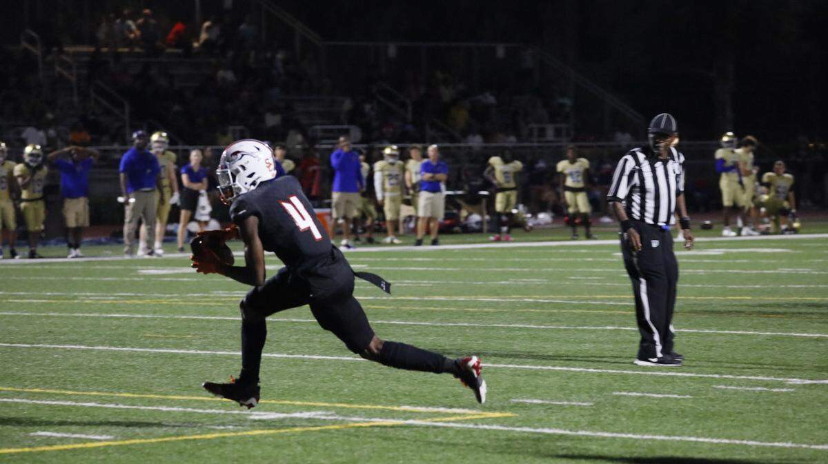 Chaminade wide receiver Jeremiah Smith reels in one of his three touchdown passes he had in the victory over Cardinal Newman on Friday night in the Lions’ win over Newman in the Region 4-1M final.