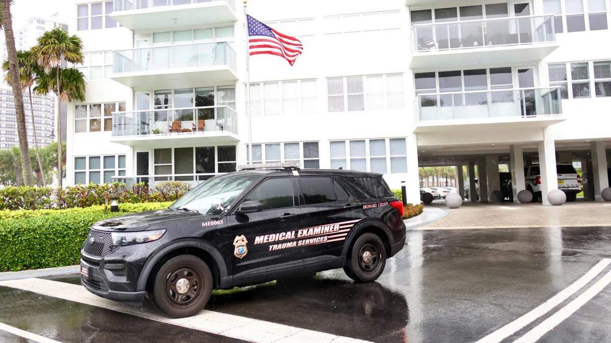 A Broward County Medical Examiner investigator is seen at the Coral Ridge Towers in Fort Lauderdale on Thursday.