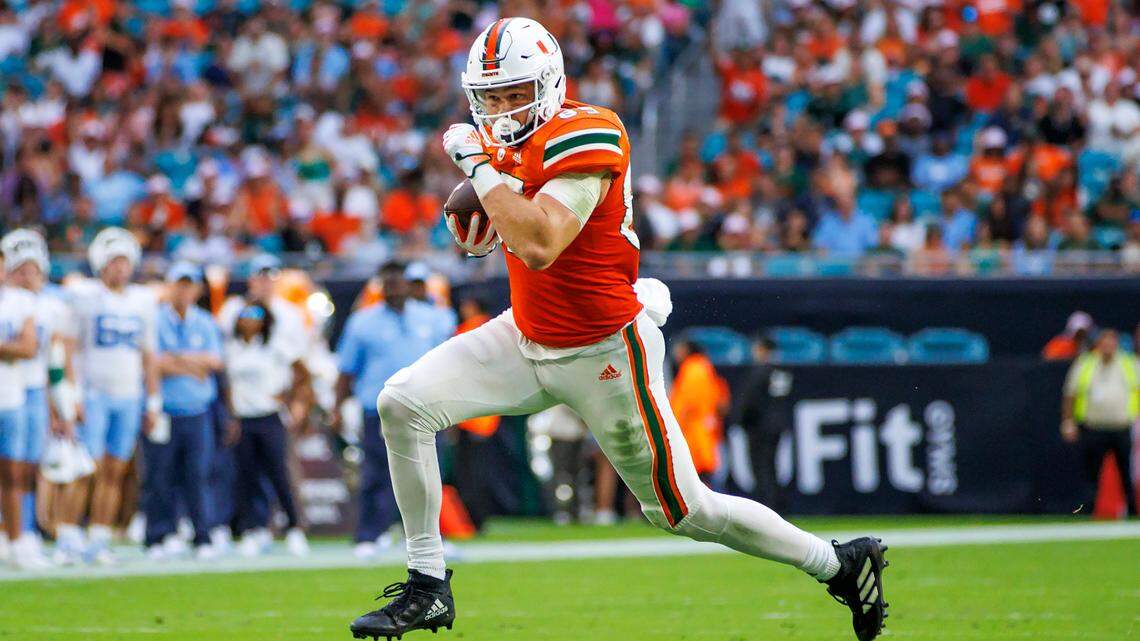 Miami Hurricanes tight end Will Mallory (85) runs with the football during the second quarter of an ACC conference football game against North Carolina Tar Heels at Hard Rock Stadium on Saturday, October 8, 2022 in Miami Gardens, Florida..
