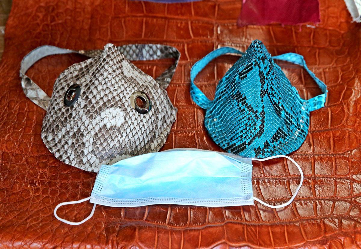 Mask made from an invasive Florida python snake in Bob Wood’s workshop in Dania, Florida, April 8, 2020. He is developing protective masks made with python, alligator and other skins as the coronavirus outbreak has made medical mask part of our daily routine recently.
