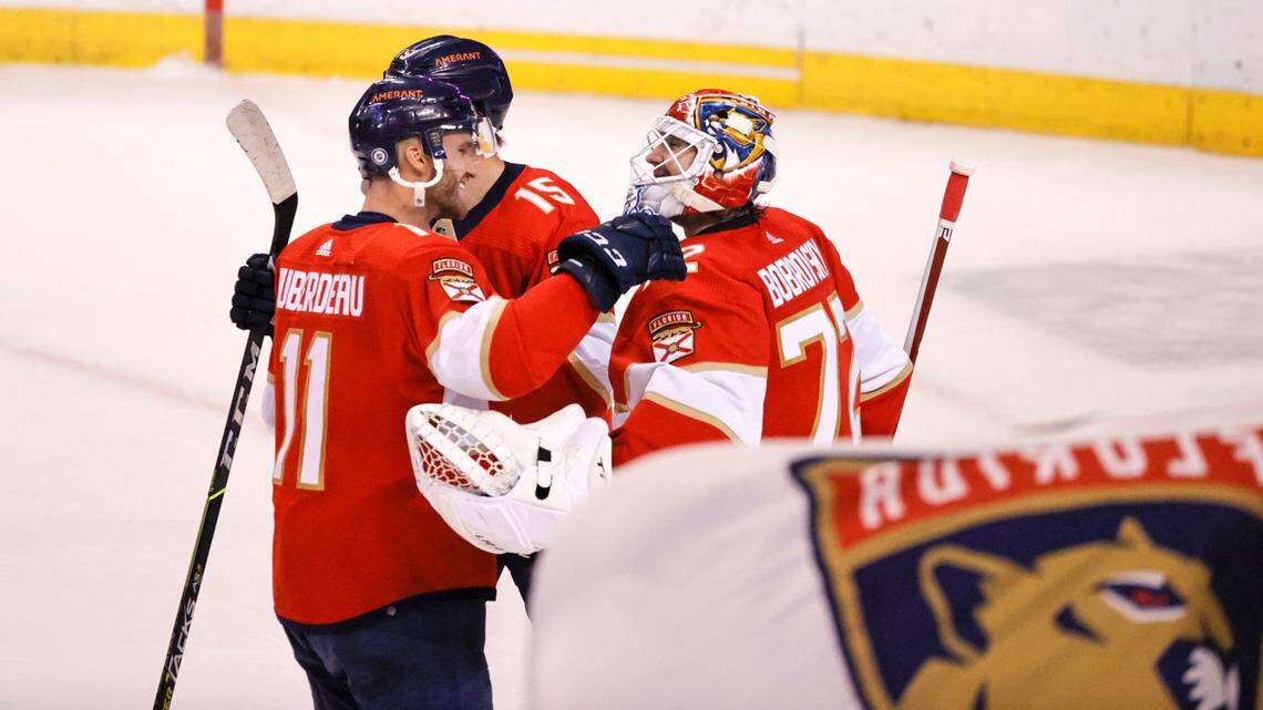 Florida Panthers players Sergei Bobrovsky (72) Jonathan Huberdeau (11) and Anton Lundell (15) celebrate their 7-1 win over during the the Dallas Stars during an NHL game at the FLA Live Arena on Friday, January 14, 2022 in Sunrise, Fl.