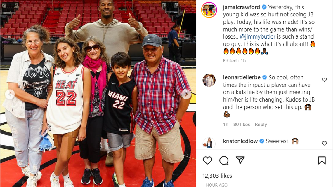 Heat star Jimmy Butler takes photos with 12-year-old Felipe, a fan from Argentina that traveled 4.405 miles to see him play. Butler did not play Tuesday, so he made it up the young fan and his family on Wednesday, Jan. 25, 2023 at FTX Arena.