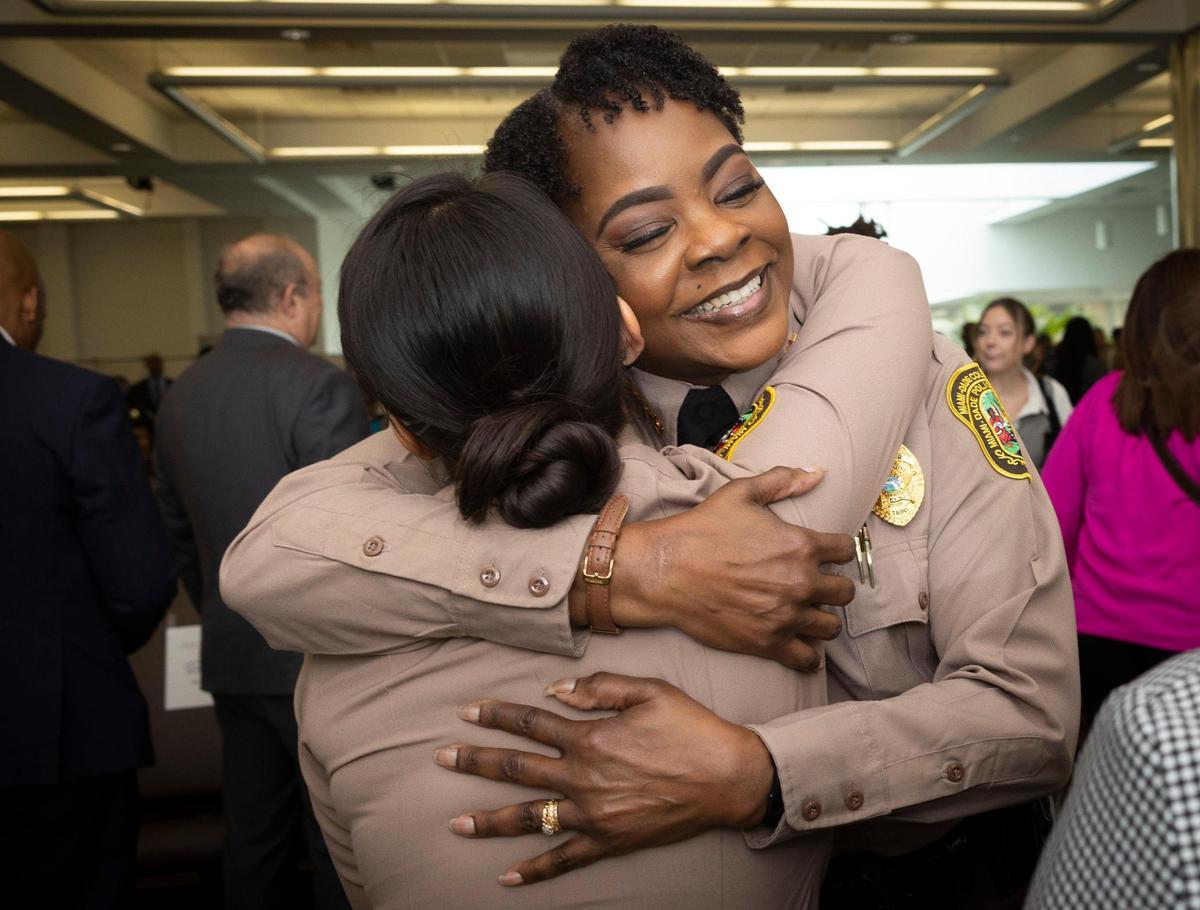 Miami-Dade Police Director Stephanie V. Daniels hugs friend and co-worker Olenka Ryan-Guerra before the start of Daniels’ investiture ceremony at PortMiami on Wednesday, Jan. 10, 2024.