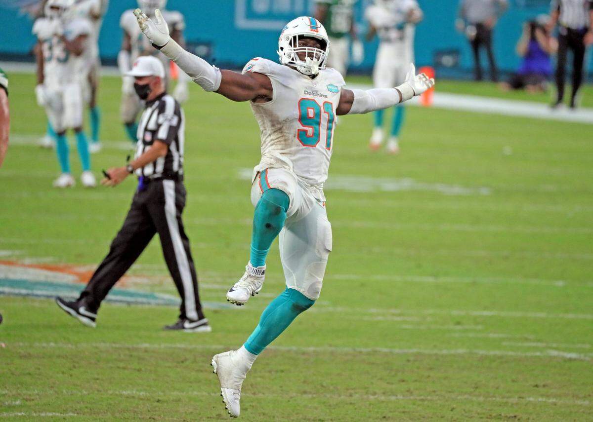 Miami Dolphins defensive end Emmanuel Ogbah (91) reacts after sacking New York Jets quarterback Joe Flacco (5) in the fourth quarter against the New York Jets at Hard Rock Stadium in Miami Gardens on Sunday, October 18, 2020.