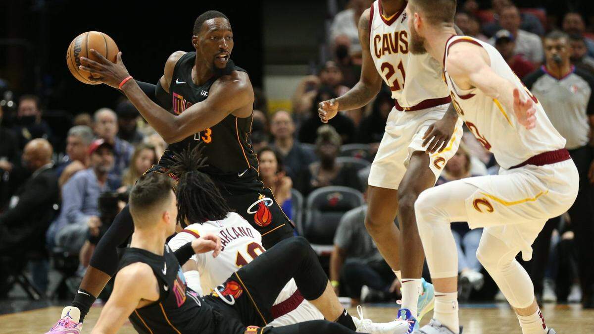 Miami Heat center Bam Adebayo (13) grabs a loose ball in the first half during the game against Cleveland Cavaliers at the FTX Arena in Miami on Friday, March 11, 2022.