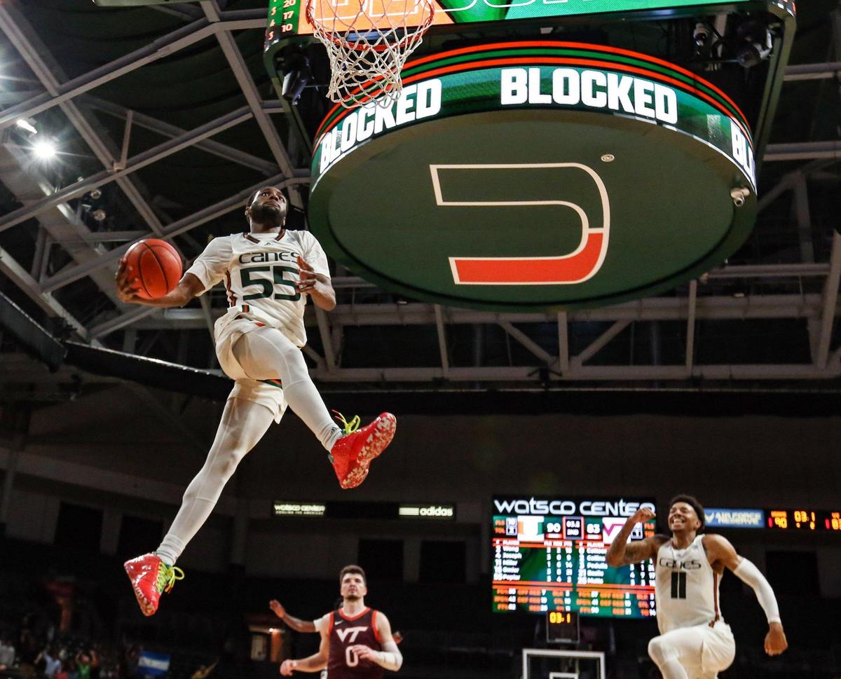 Miami Hurricanes guard Wooga Poplar (55) dunks the ball in the final minutes of the second half against Virginia Tech Hokies at Watsco Center in Coral Gables, Florida on Tuesday, January 31, 2023.