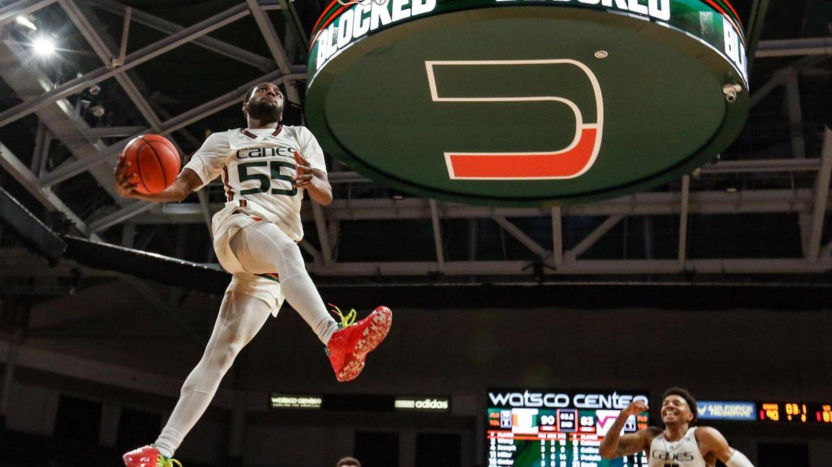 Miami Hurricanes guard Wooga Poplar (55) dunks the ball in the final minutes of the second half against Virginia Tech Hokies at Watsco Center in Coral Gables, Florida on Tuesday, January 31, 2023.