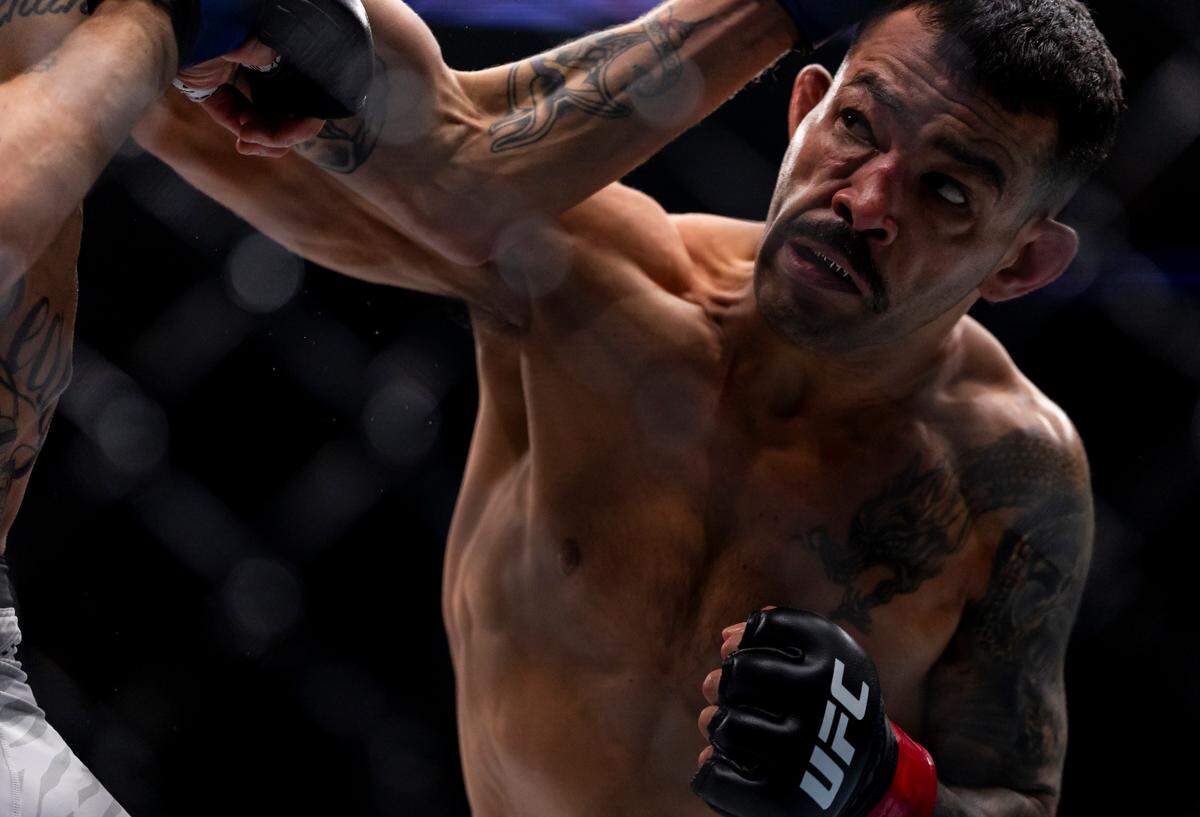 Dan Ige of the United States fights against Sean Woodson of the United States in their featherweight bout during UFC 314 at the Kaseya Center on Saturday, April 12, 2025, in downtown Miami, Fla.