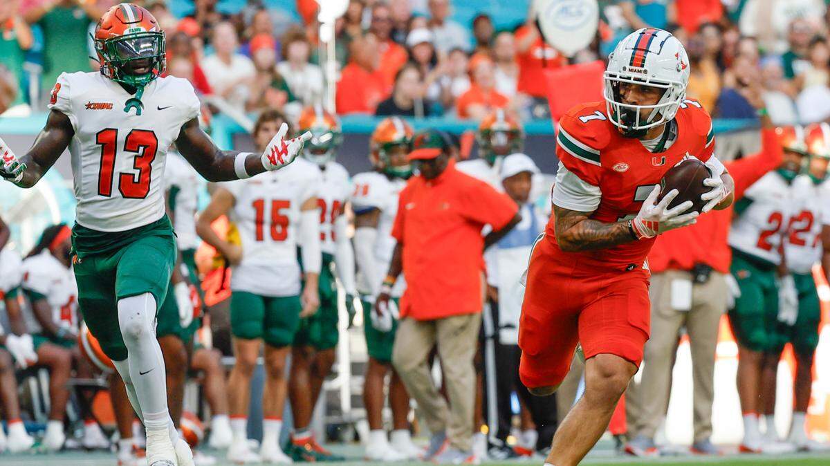 Miami Hurricanes wide receiver Xavier Restrepo (7) runs in to score in the first half during the game against the Florida A&M Rattlers at Hard Rock Stadium in Miami Gardens, Florida, on Saturday, September 7, 2024. 

