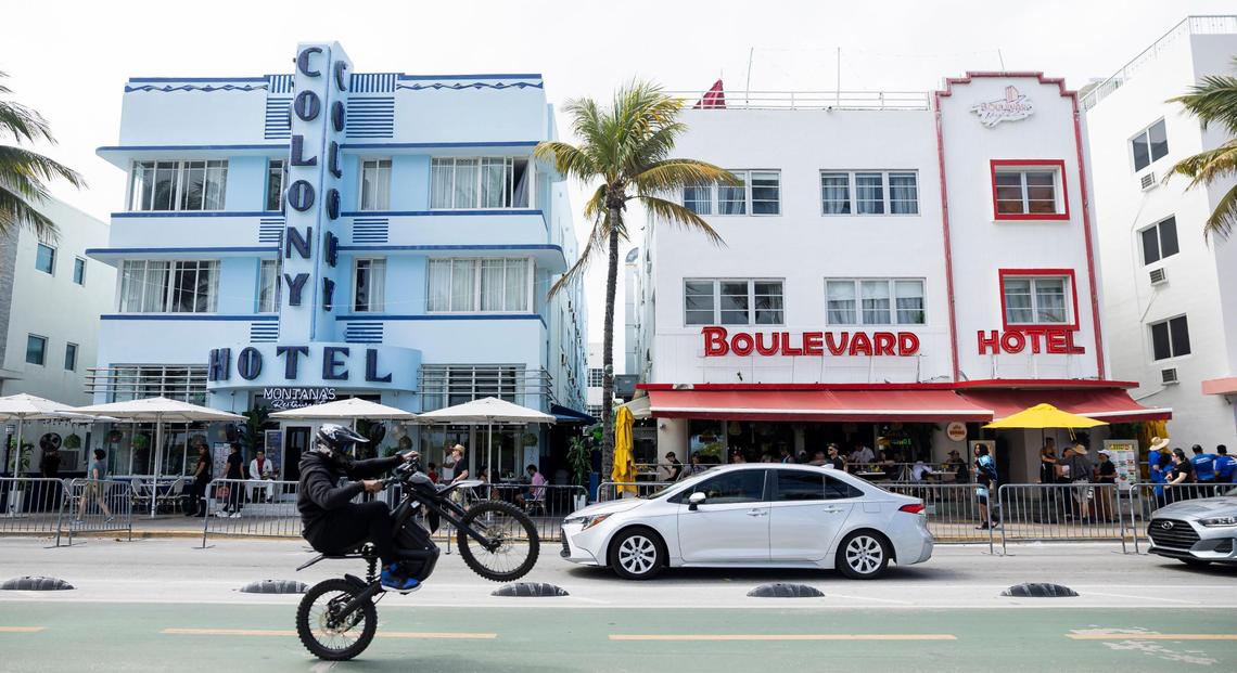 A biker makes his way down Ocean Drive during spring break on Saturday, March 15, 2025, in Miami Beach, Fla.