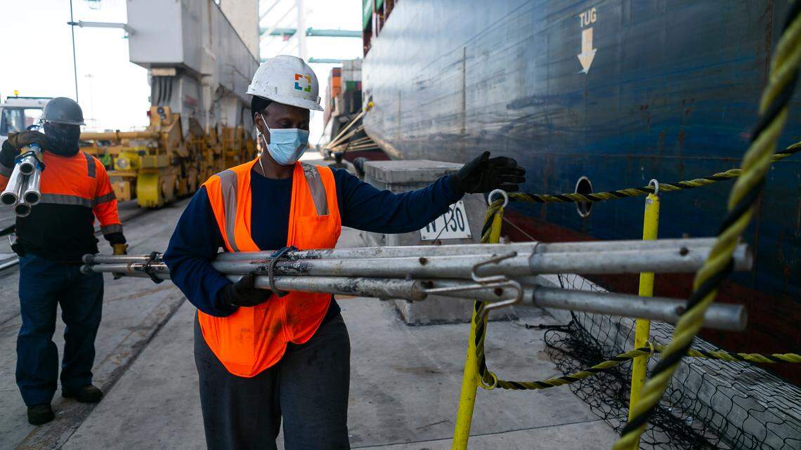 Longshorewoman Eunice Adams makes her way onto a cargo ship at PortMiami on Saturday, February 20, 2021. Adams has been working as a longshorewoman for 30 years.