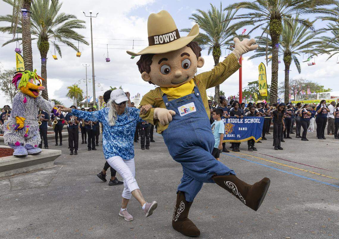 Ginette Lester, 79, dances with Howdy as she celebrates the opening day of the 74th annual Miami-Dade County Youth Fair on Thursday, March 12, 2026, in Miami, Fla.