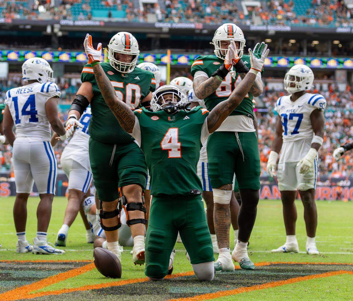 Miami Hurricanes running back Mark Fletcher Jr. (4) reacts after scoring a touchdown during the second half of an ACC football game against the Duke Blue Devils at Hard Rock Stadium on Saturday, Nov. 2, 2024, in Miami Gardens, Fla.