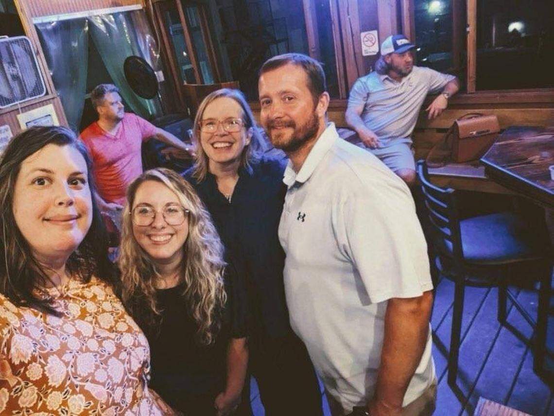 Watkins is seen with members of the Georgia Innocence Project the evening of his release. Christina Cribbs, Meagan Hurley and Claire Gilbert are pictured from front to back.