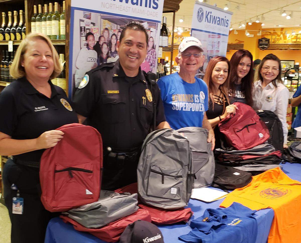 Members of The Kiwanis Club of Northeast Miami-Dade recently partnered with the Sunny Isles Beach Police Department to host their annual backpack giveaway at Milam’s Market.