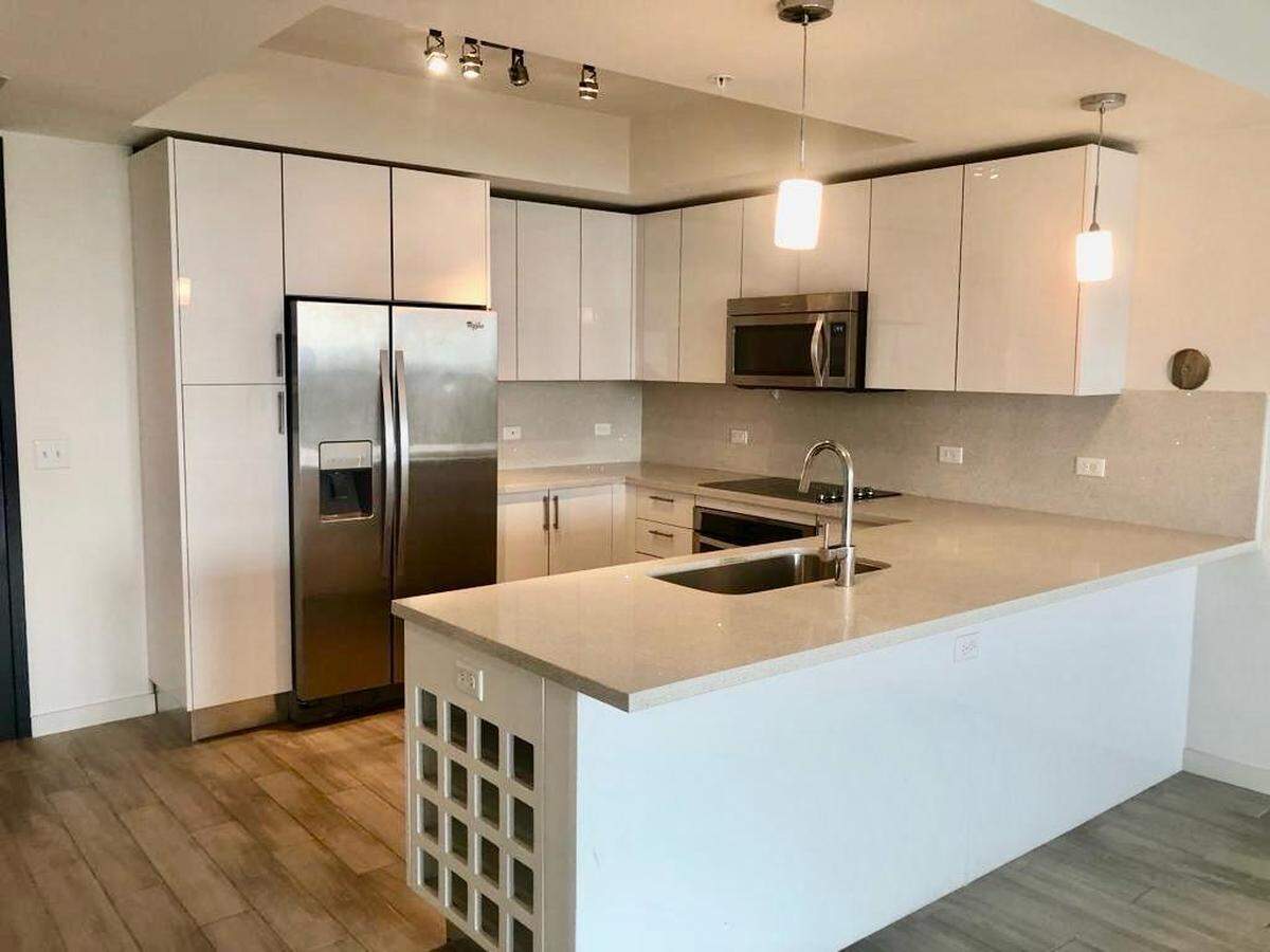 The U-shaped kitchen, pictured above, comes with stainless steel appliances.