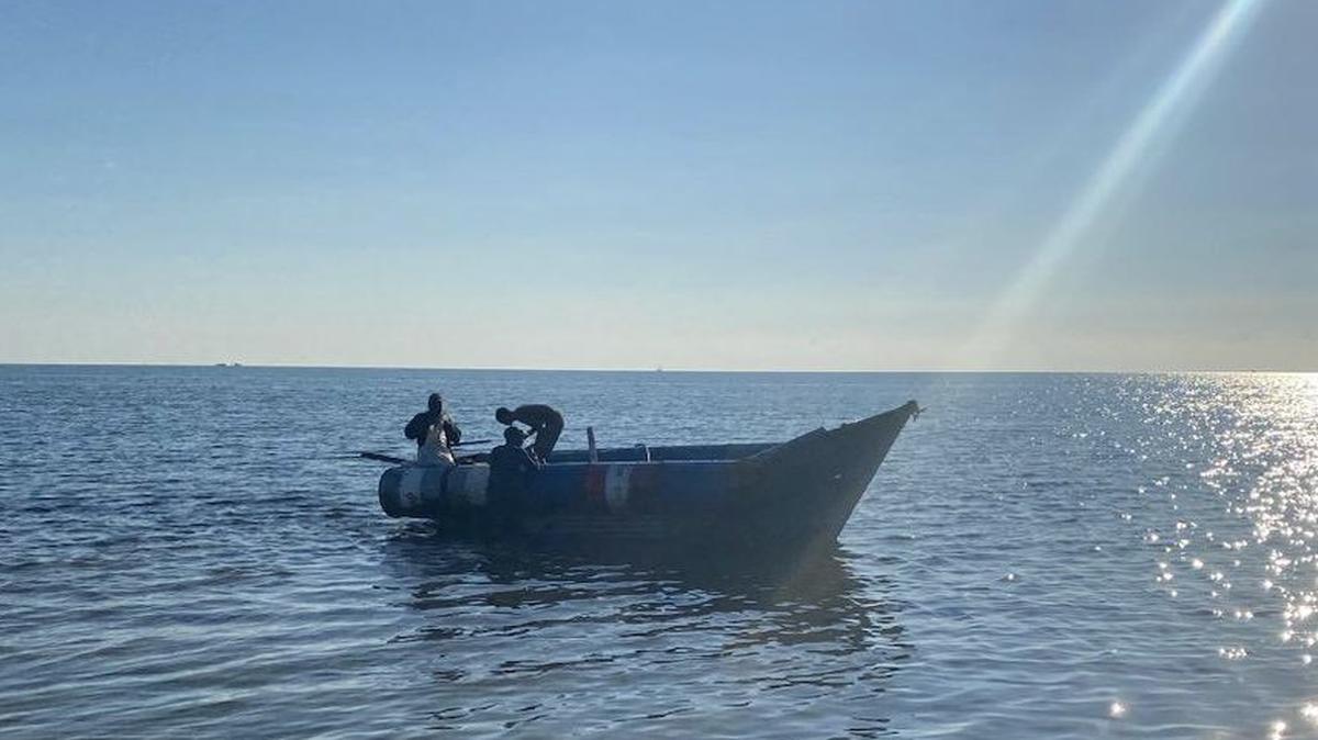 Three Cuban men arrive in the Florida Keys Sunday, Dec. 11, 2022, in a homemade migrant vessel.