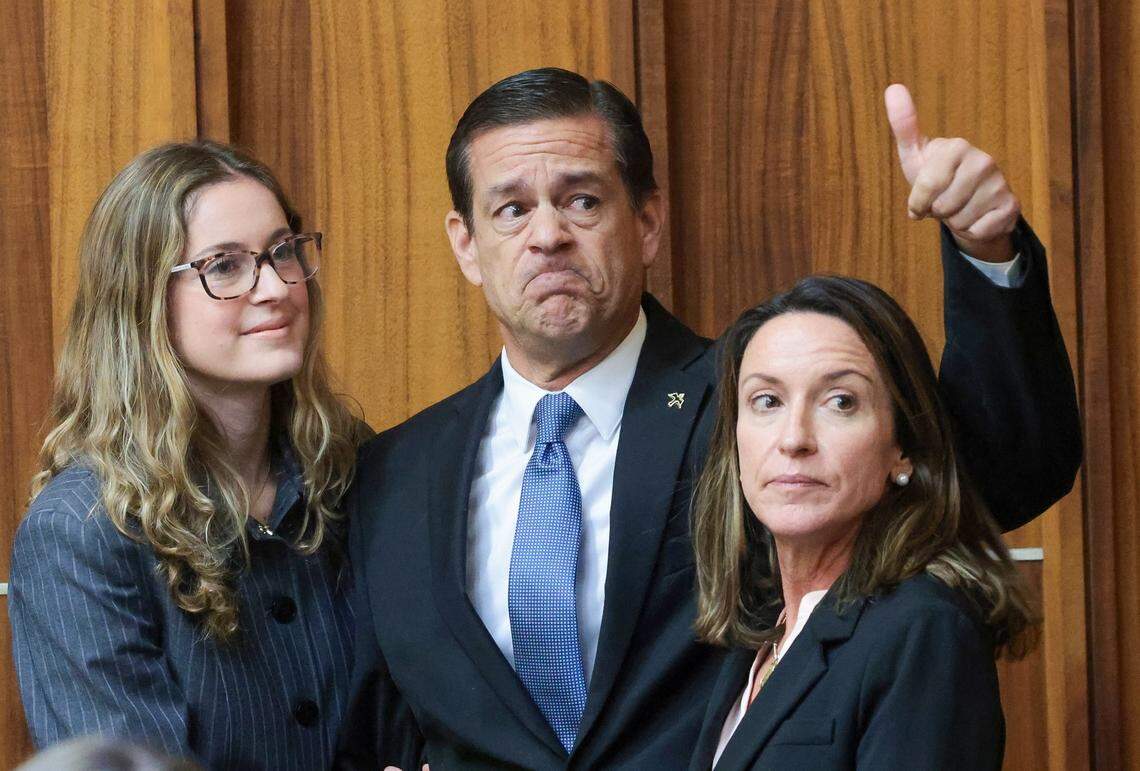 Flanked by his daughter, Carolina Pino, left, and wife, Cecilia Pino, right, real estate broker George Pino acknowledges supporters as they arrive in Courtroom 4-1 for his surrender at the Richard E. Gerstein Justice Building on Thursday, November 21, 2024, in Miami, Florida.