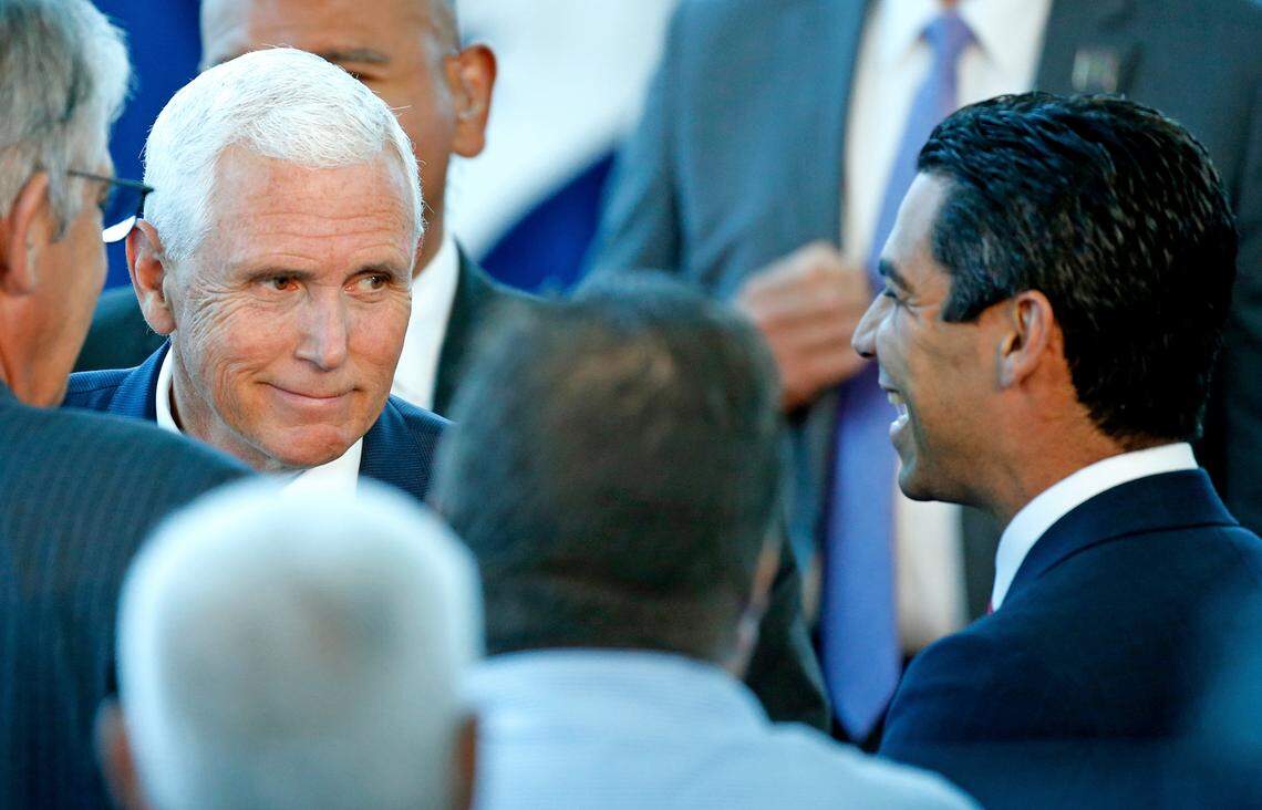 Vice President Mike Pence is seen with Miami Mayor Francis X. Suarez after visiting the U.S. Navy hospital ship USNS Comfort at the Port of Miami on Tuesday, June 18, 2019.