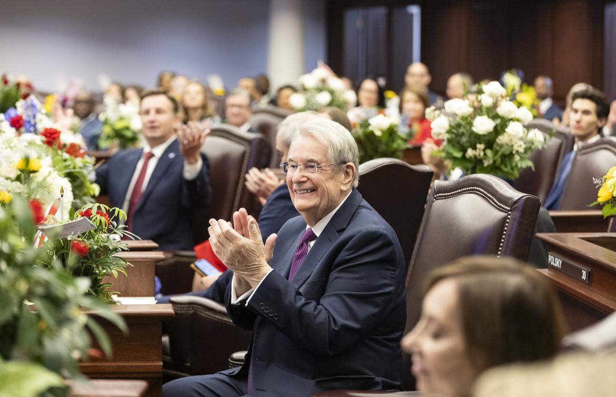 Sen. Don Gaetz claps during the first day of the legislative session at the Florida State Capitol. Gaetz introduced legislation to permit armed security officers at houses of worship. 